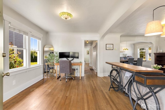 1002 S Adams St, Tacoma, WA 98405 - office space with arched walkways, wood finished floors, plenty of natural light, and baseboards