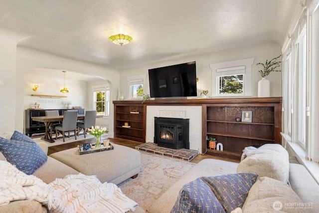 1002 S Adams St, Tacoma, WA 98405 - living room featuring arched walkways and wood finished floors