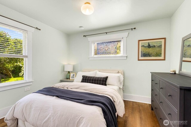 1002 S Adams St, Tacoma, WA 98405 - bedroom featuring dark wood-style flooring and baseboards
