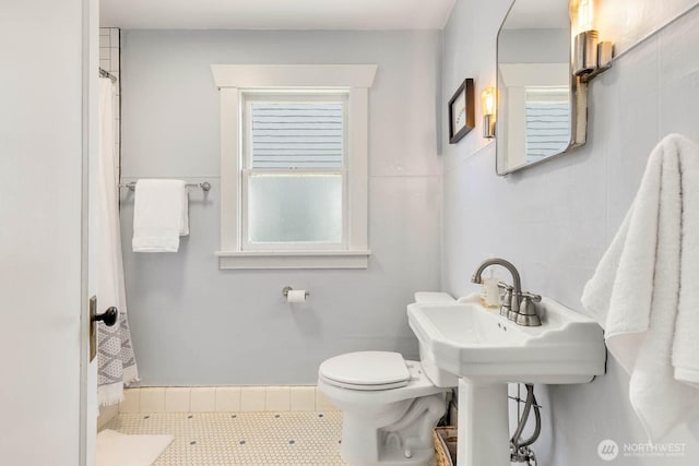 1002 S Adams St, Tacoma, WA 98405 - bathroom with toilet, curtained shower, and tile patterned floors