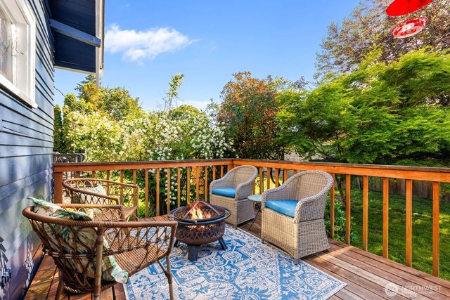 1002 S Adams St, Tacoma, WA 98405 - wooden deck with a fire pit