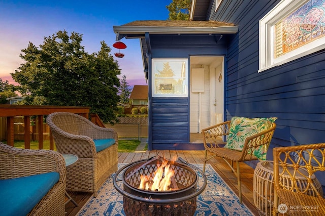 1002 S Adams St, Tacoma, WA 98405 - deck at dusk featuring an outdoor fire pit