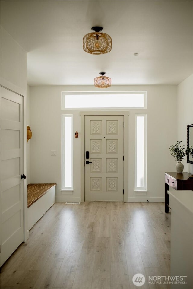 entryway with light wood-type flooring