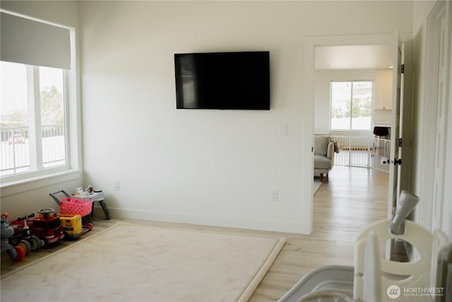 living room featuring baseboards and wood finished floors
