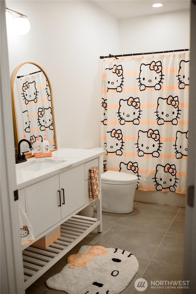 full bath featuring tile patterned floors, vanity, and toilet