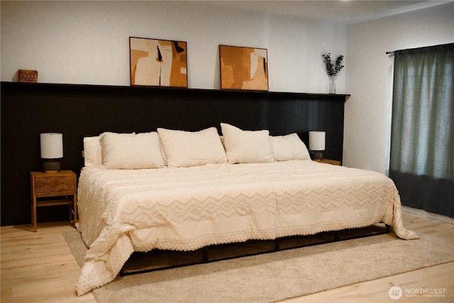 bedroom with wood finished floors