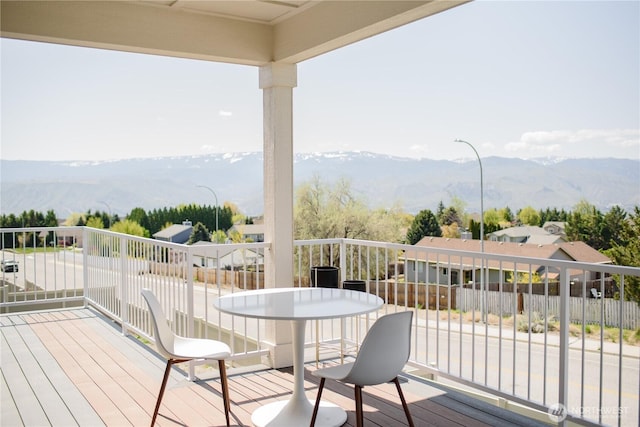 wooden terrace featuring a mountain view
