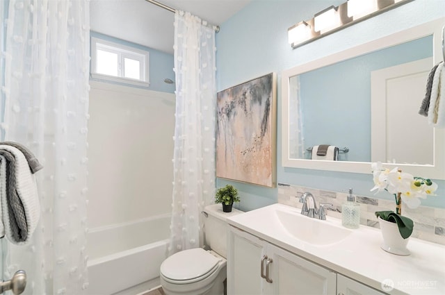 bathroom with toilet, shower / bathtub combination with curtain, and vanity