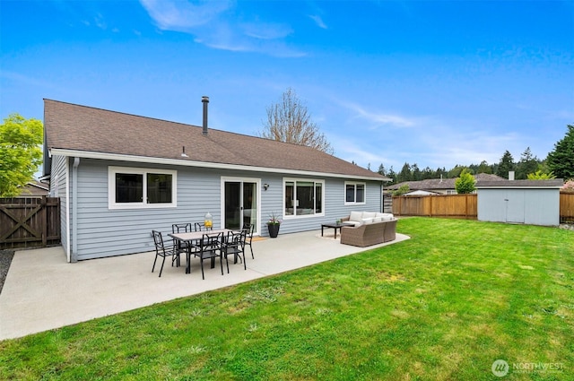back of house with a lawn, outdoor lounge area, a fenced backyard, and a patio area
