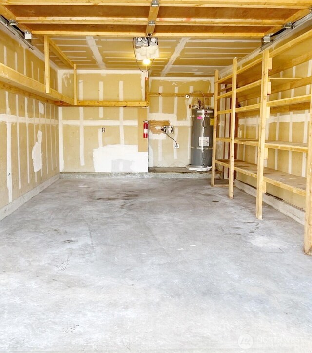 garage featuring a garage door opener and water heater