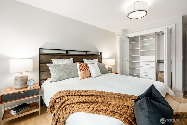 bedroom with a closet and wood finished floors