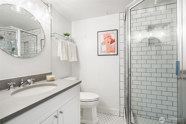 bathroom featuring vanity, a stall shower, tile patterned floors, and toilet