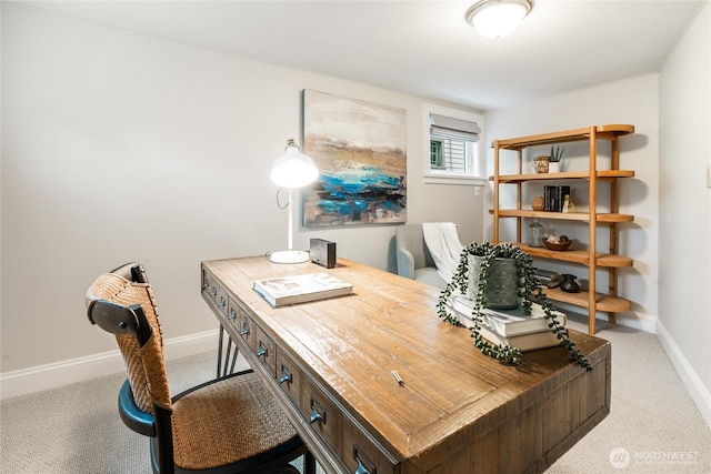 carpeted office featuring baseboards