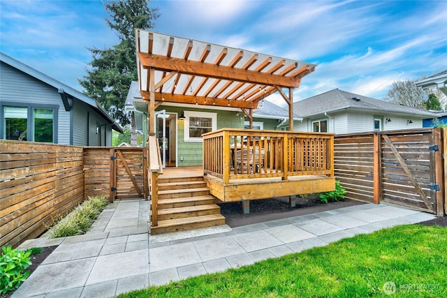 wooden terrace featuring a gate, a fenced backyard, and a pergola