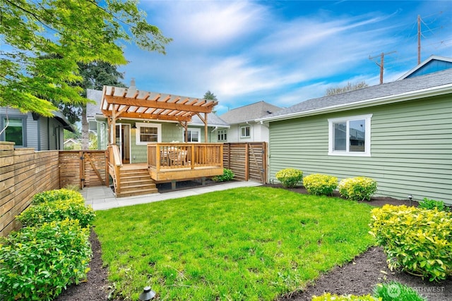 back of house with a fenced backyard, a yard, a wooden deck, and a pergola