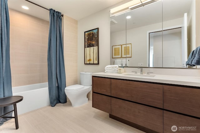 bathroom featuring vanity, shower / tub combo with curtain, tile patterned flooring, and toilet
