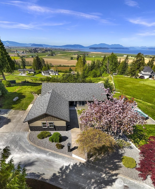 birds eye view of property with a mountain view