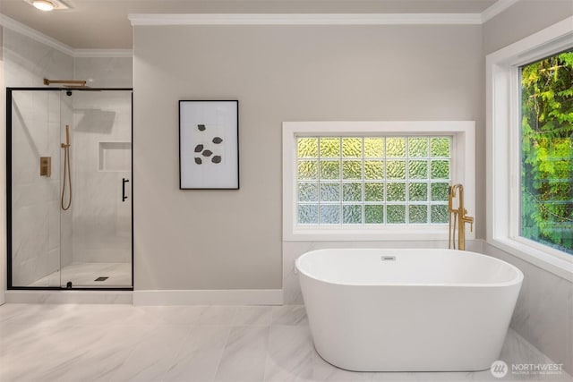 9732 Slater Ave NE, Kirkland, WA 98033 - bathroom featuring crown molding, marble finish floor, baseboards, a soaking tub, and a stall shower