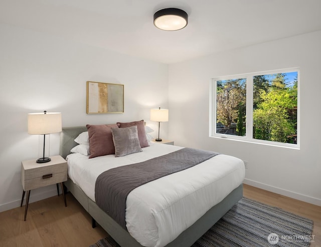9732 Slater Ave NE, Kirkland, WA 98033 - bedroom with baseboards and wood finished floors