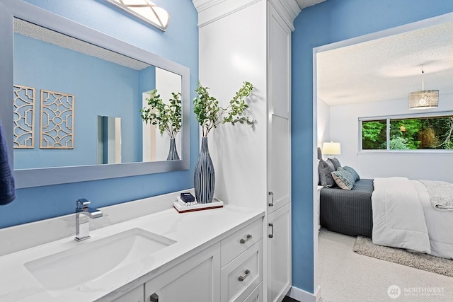 bathroom with vanity and a textured ceiling