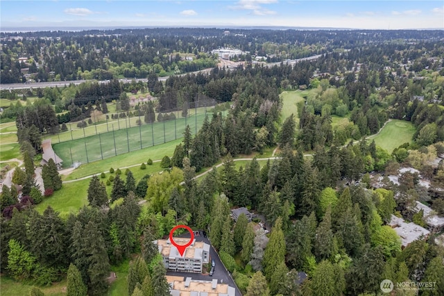 aerial view featuring a view of trees