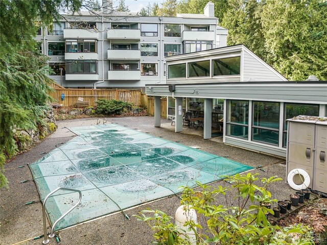 13743 15th Ave NE Unit D6, Seattle, WA 98125 - back of property featuring a patio area and a chimney