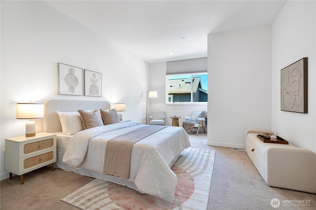 bedroom with carpet flooring and baseboards