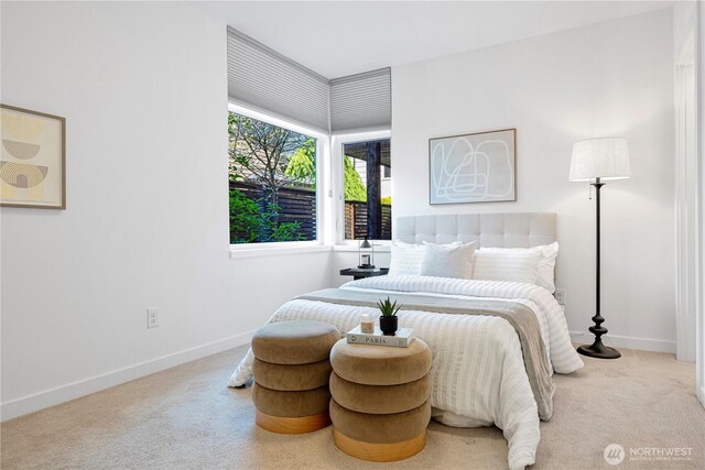 carpeted bedroom with baseboards
