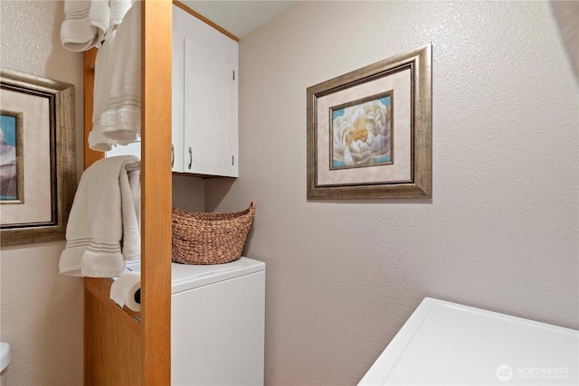 laundry room with a textured wall