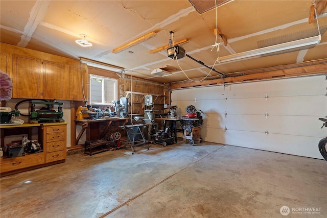 garage featuring a workshop area and a garage door opener