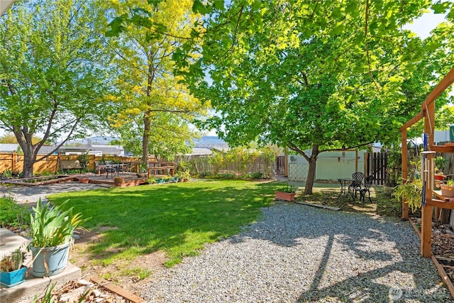 view of yard with a fenced backyard