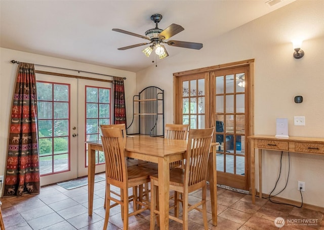 dining space featuring french doors, plenty of natural light, light tile patterned flooring, and ceiling fan