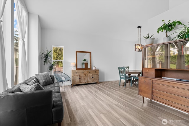 6411 86th Street Ct E, Puyallup, WA 98371 - interior space featuring an inviting chandelier, light wood-style floors, and baseboards
