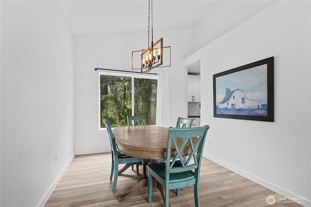6411 86th Street Ct E, Puyallup, WA 98371 - dining room featuring baseboards, light wood-type flooring, and a chandelier