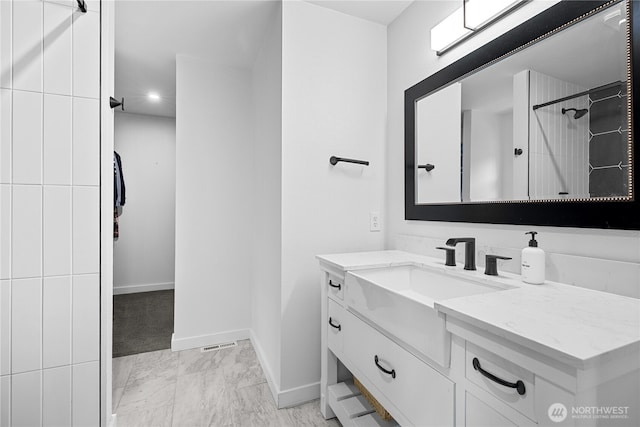 6411 86th Street Ct E, Puyallup, WA 98371 - bathroom featuring walk in shower, baseboards, and vanity