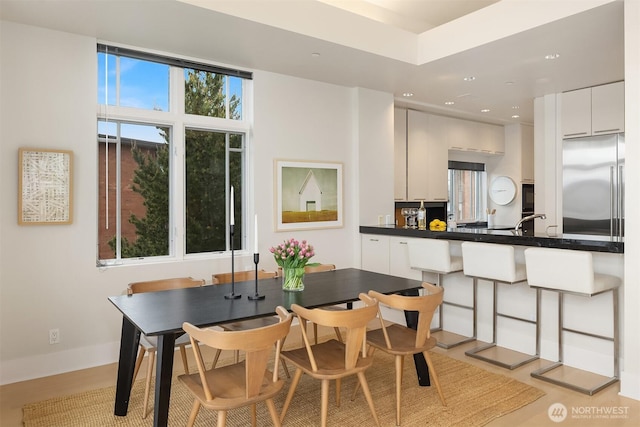 dining room featuring recessed lighting and baseboards