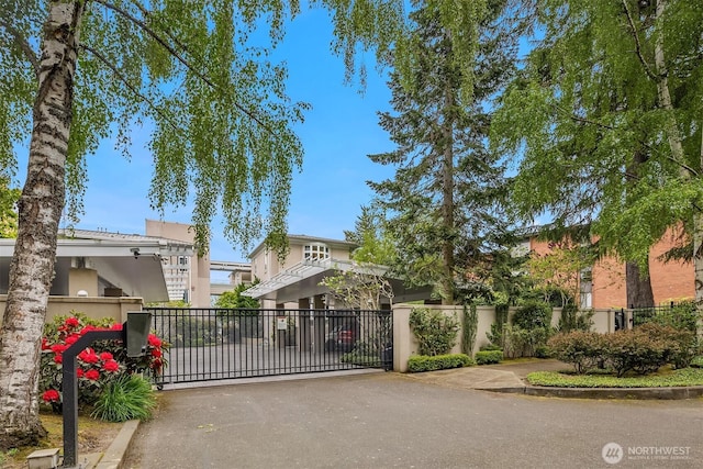 view of gate with fence