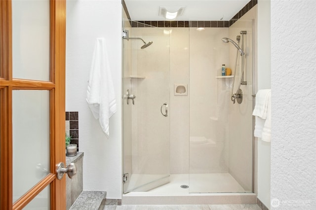bathroom featuring a shower stall