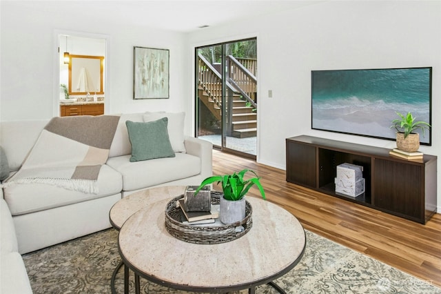 living room featuring baseboards and wood finished floors