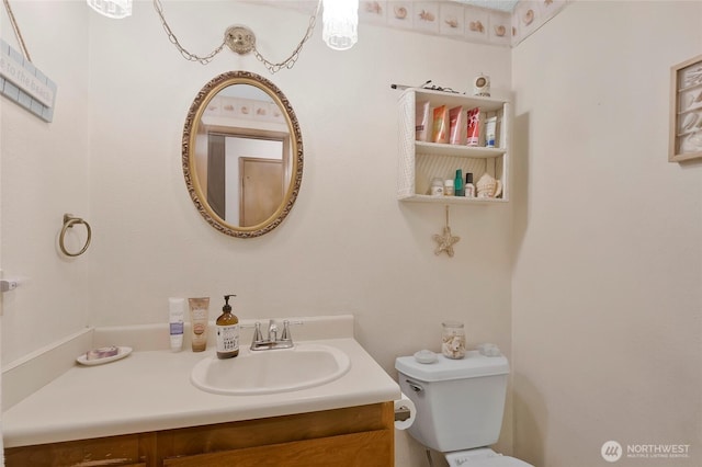 half bath with vanity and toilet