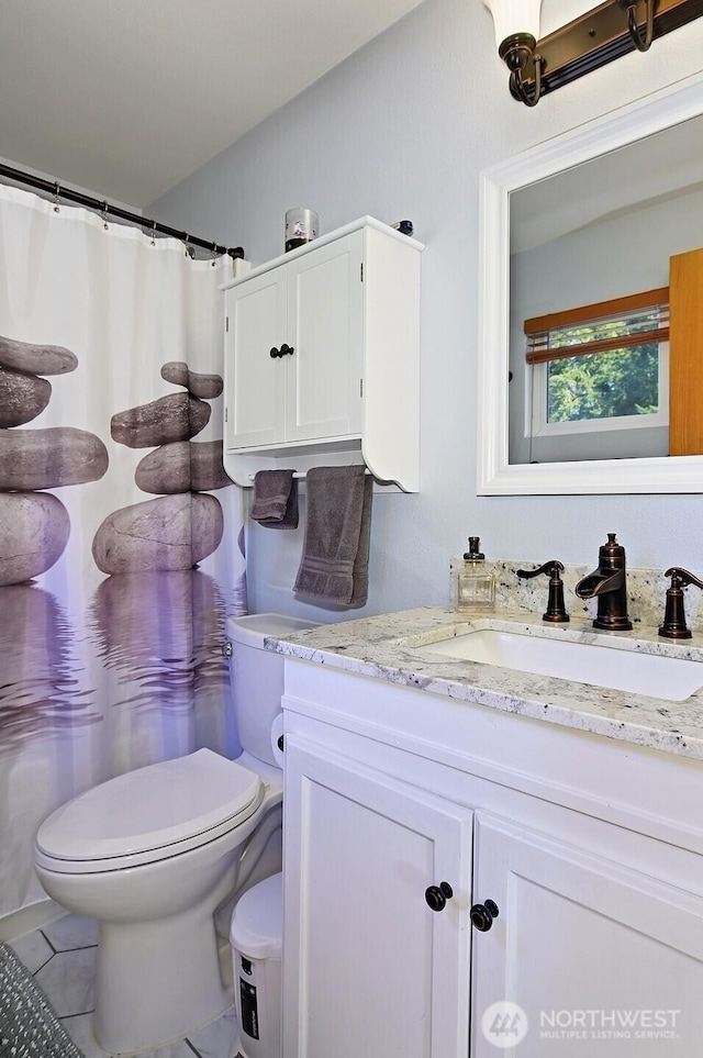 full bath with toilet and vanity