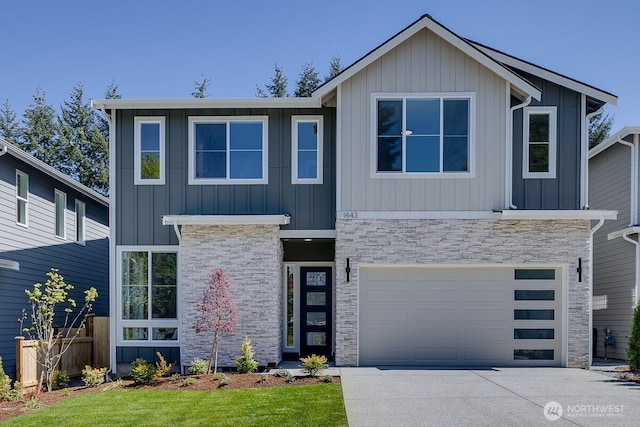 1433 238th St SE, Bothell, WA 98021 - view of front of house with a garage, board and batten siding, concrete driveway, and stone siding