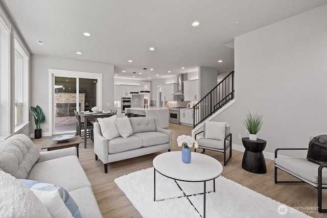 1433 238th St SE, Bothell, WA 98021 - living area featuring recessed lighting, baseboards, light wood-type flooring, visible vents, and stairway