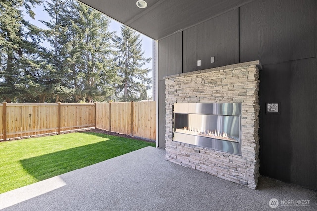 1433 238th St SE, Bothell, WA 98021 - view of yard with an outdoor stone fireplace, a fenced backyard, and a patio area