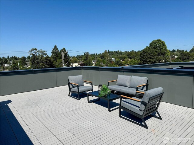 view of patio featuring an outdoor living space and a balcony