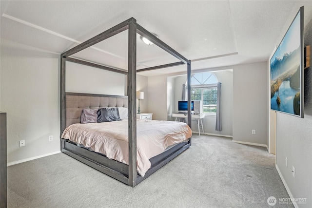 bedroom with baseboards and carpet