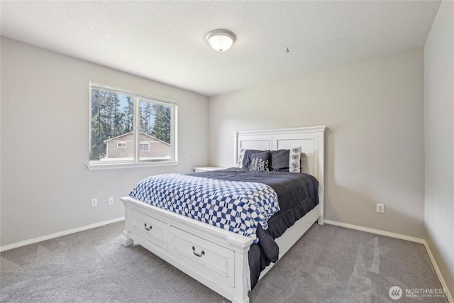 bedroom featuring baseboards and carpet