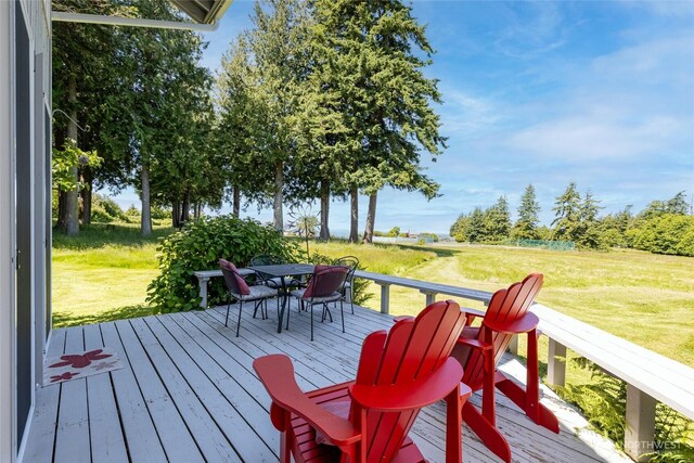 2877N Nugent Rd Unit M4, Lummi Island, WA 98262 - deck featuring outdoor dining area and a lawn