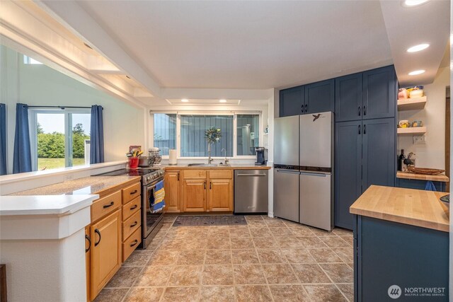 2877N Nugent Rd Unit M4, Lummi Island, WA 98262 - kitchen featuring appliances with stainless steel finishes, a sink, recessed lighting, a peninsula, and butcher block counters