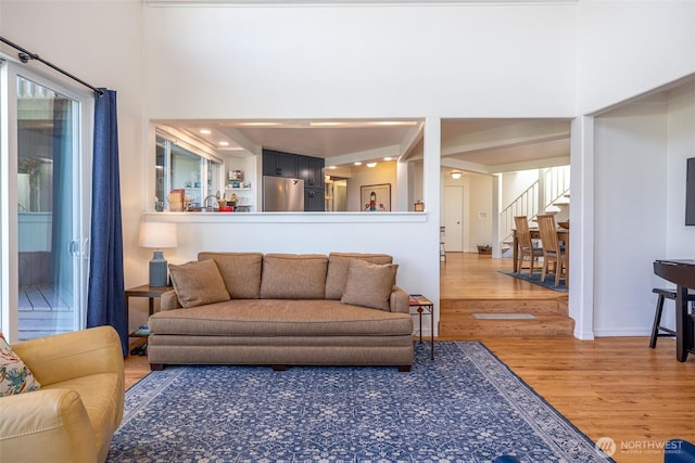 2877N Nugent Rd Unit M4, Lummi Island, WA 98262 - living room with wood finished floors, stairs, and a high ceiling